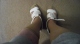 Putting on the older white sandals. Click to see shuz2trash’s pic